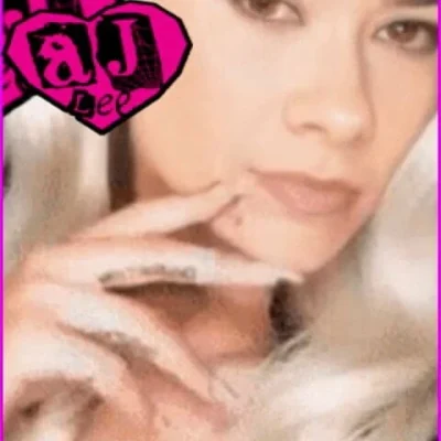 AJ Lee shows her blonde hair wig with chin mole