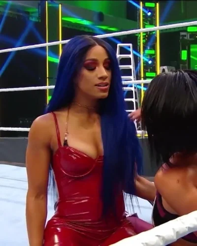 WWE – Sasha Banks in hot red outfit looking out for Bayley