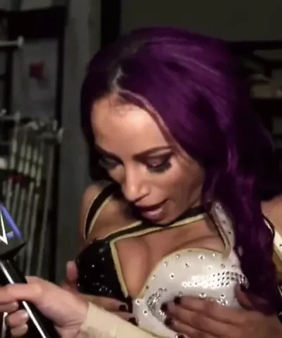 Sasha Banks touch her boobs